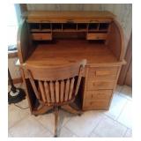 Antique roll top desk with chair on wheels -