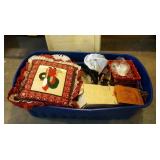 large Rubbermaid tote of holiday decor, metal tree