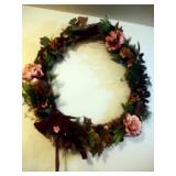 Holiday wreathes, boughs, and purple decor