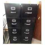 2 black 4 drawer filing cabinets - one marked Hon