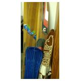 5 vintage water skiis and blue snowboard