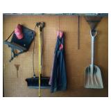 NW corner of garage - shovels, rake, hunting seat,