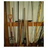 lot of hand tools - 3 axes, post hole digger, 4