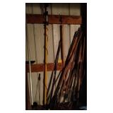 lot of hand tools - roof rake, garden rake, pole