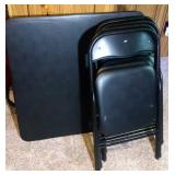 card table and 4 folding chairs - black in color