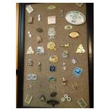 bulletin board of 40+ pins, some Packers