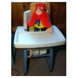 Little Tykes high chair and Yosemite Sam doll