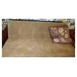 futon, pillow and 5 by 7 area rug