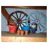 2 wagon wheels and 12 terra cotta pots