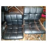 2 black pedestal chairs - adjustable height,