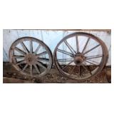 2 wagon wheels - 22 inch and 25 inch diameters 2 wagon wheels - 22 inch and 25 inch diameters