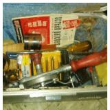 make up case with hand drill, portions of hole saw