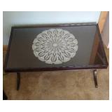 glass top coffee table with doily