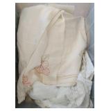 lot of hot pads, table clothes, draperies, doilies