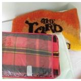 red plaid blanket, green blanket, pink rose