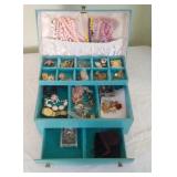 blue jewelry box with contents - necklaces, clip