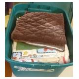 tote of linens, towels and table clothes.