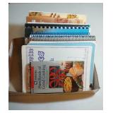 flat of cookbooks, serving platters, butter dishes