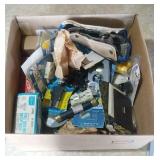 box of electrical supplies and bicycle seat