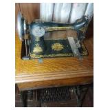 Singer foot pump sewing machine in cabinet