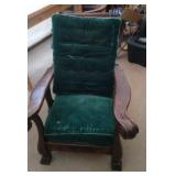 large fireside chair with green cushions