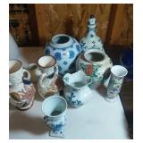 vases or jars marked Delft, Holland, and China