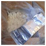 medium box of plastic spoons and vacuum sealer