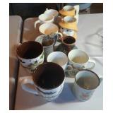 12 coffee mugs including soldier and Fisherman