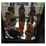 tall figures, amber glass boot, purple cup and