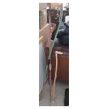 2 archery bows and 1 walking stick