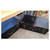 2 black trunks - 30 inch wide, 16 inch deep and 12