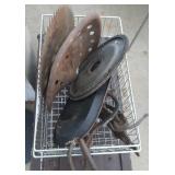saw blade, tractor seat, fly wheel, tongs, griddle
