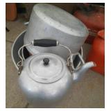large kitchen pots, colanders and tea kettle