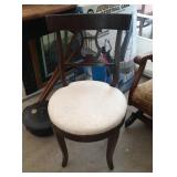 white upholstered round chair