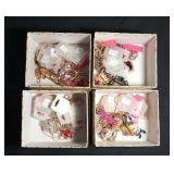 4 boxes of costume necklaces - Minion, Hello Kitty