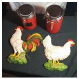 2 red canisters with bales and 2 chicken decor