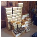 large lot of gold and cream nesting gift boxes