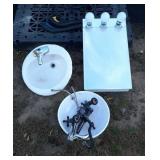 2 sinks, 2 faucets, mirrored bathroom medicine