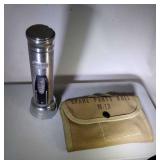 M-13 spare parts roll and metal flashlight