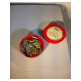 Vintage plastic container with 30 foreign coins