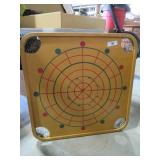 carrom wooden board game with books and pieces