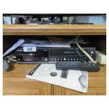 phillips dvd/vcr player w/remote & books