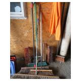 PILE OF BROOMS