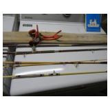 4 VINTAGE FISHING POLES AND 1 HOLDER