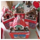 4 wooden lighted christmas houses