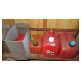 3 plastic gas cans, funnels