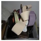 tote of wallets, belts, sunglasses