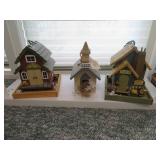 2 bird feeders and a bird house