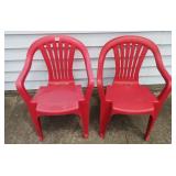 2 plastic red chairs
