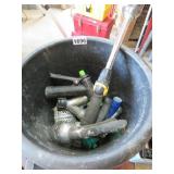 PLANTER FULL OF GARDEN HOSE ENDS